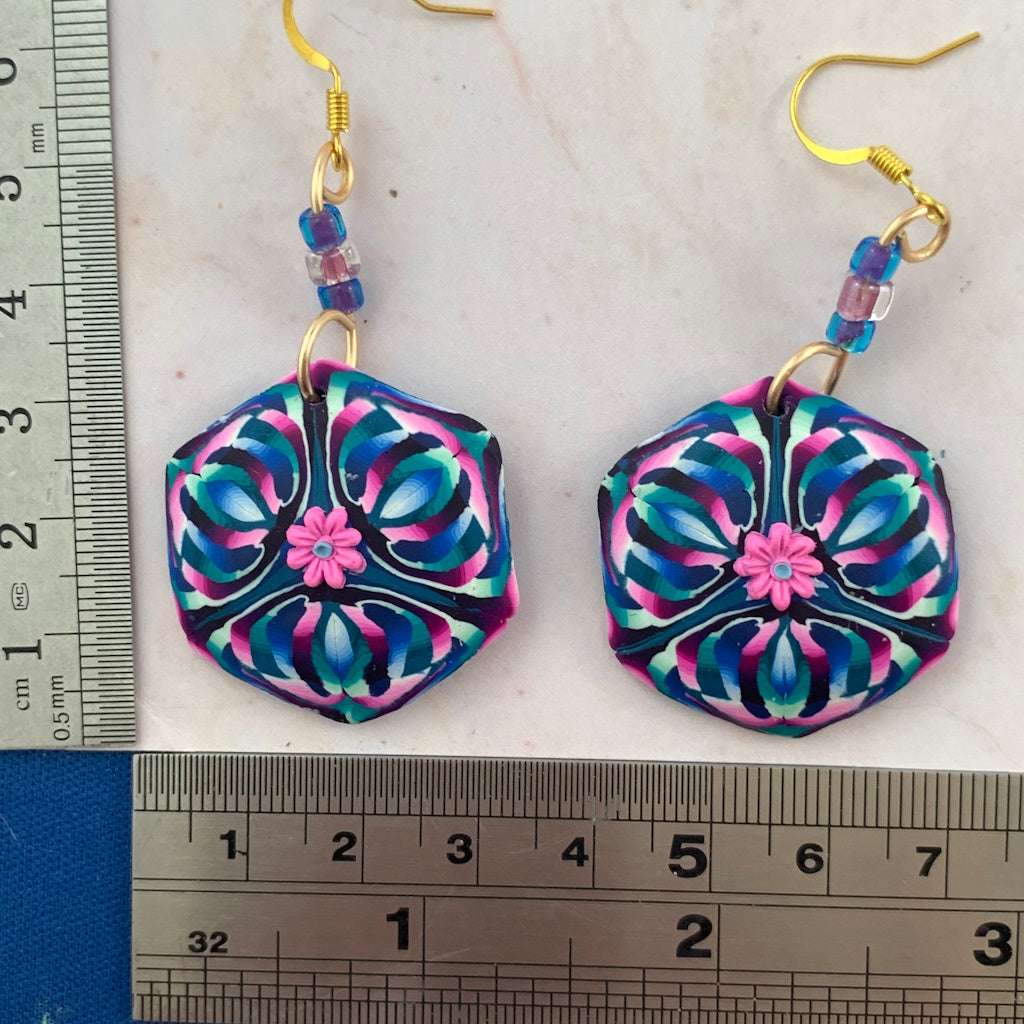 Pink purple and blue floral statement earrings with size reference, handmade polymer clay wearable art jewellery
