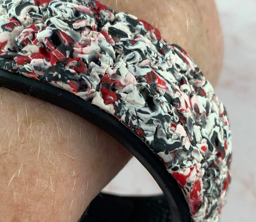 Rennique red black white bracelet close up texture artisan sculpted statement polymer clay cuff bold abstract geometric wearable art jewellery