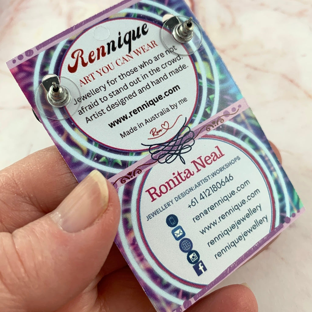 Back view of handmade red black and white stud earrings with secure post backing