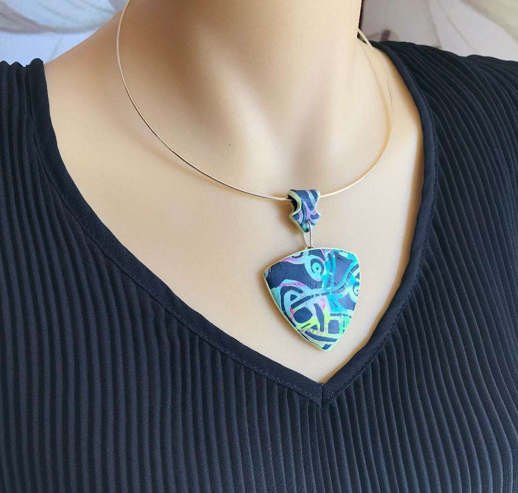 Handmade green and black Melbourne laneway statement pendant necklace worn on silver neck wire, unique artisan jewellery Australia