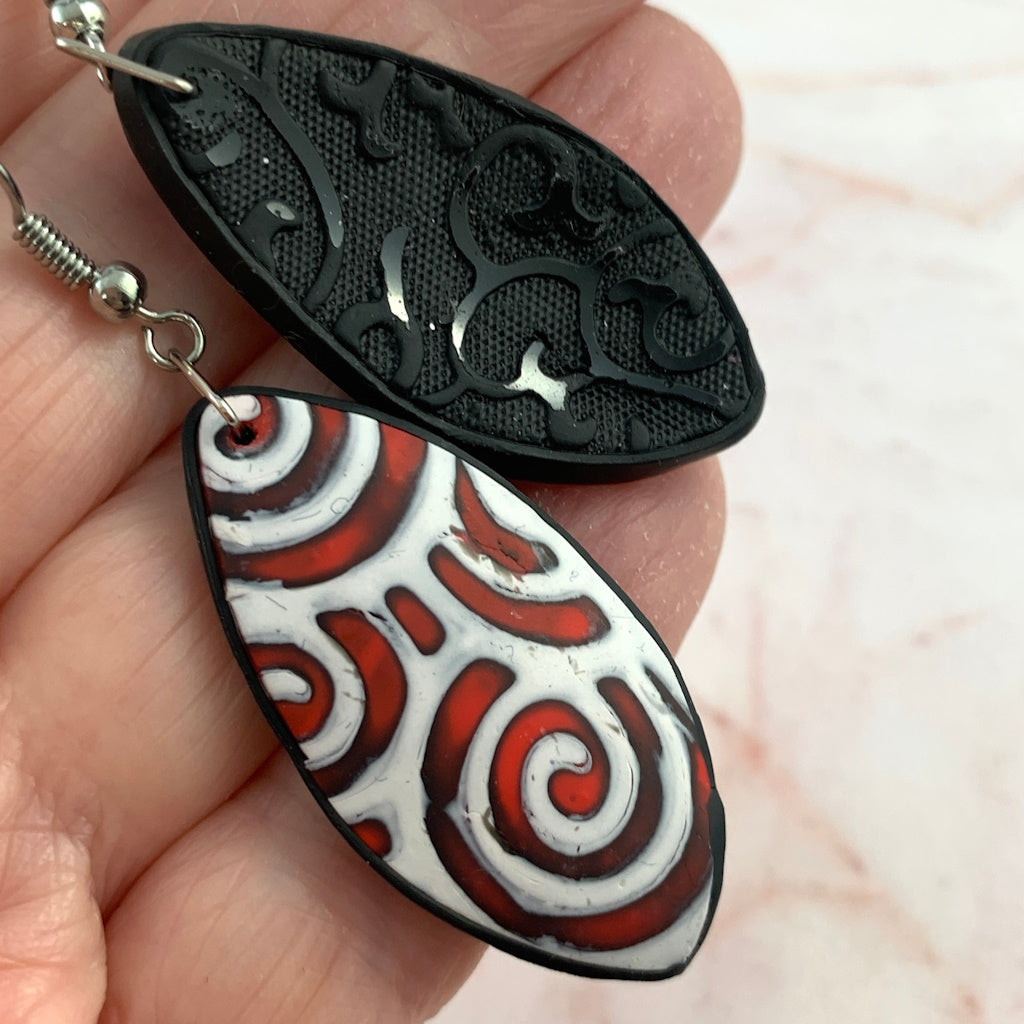 Red and White spiral pattern earrings.