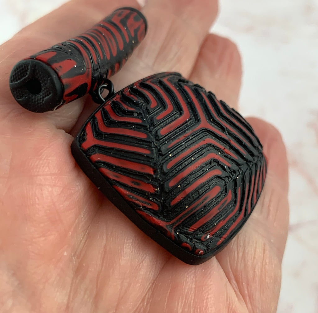 Red and black geometric pendant and earring set
