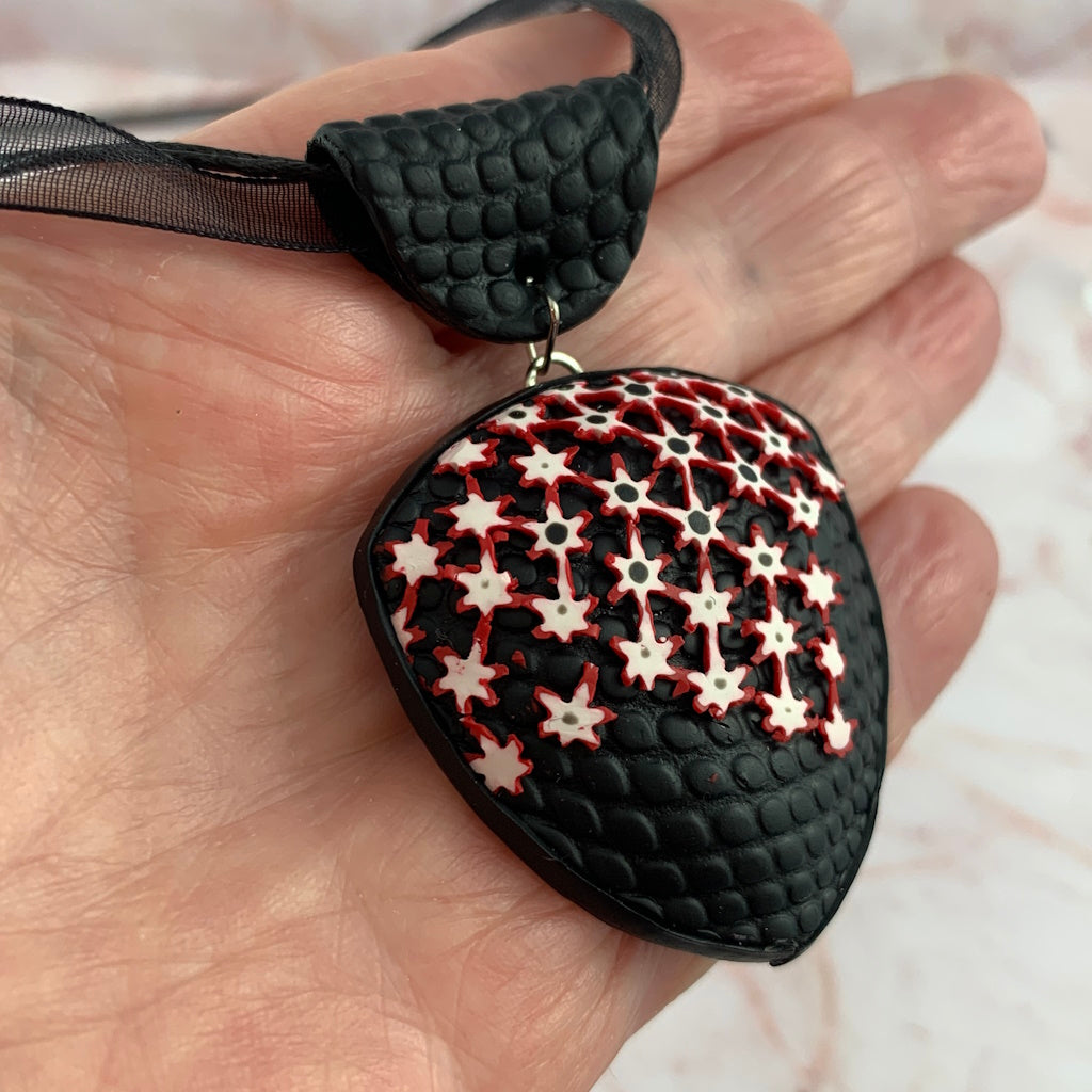 Feature Pendant with bold raised geometric pattern-red,white and black