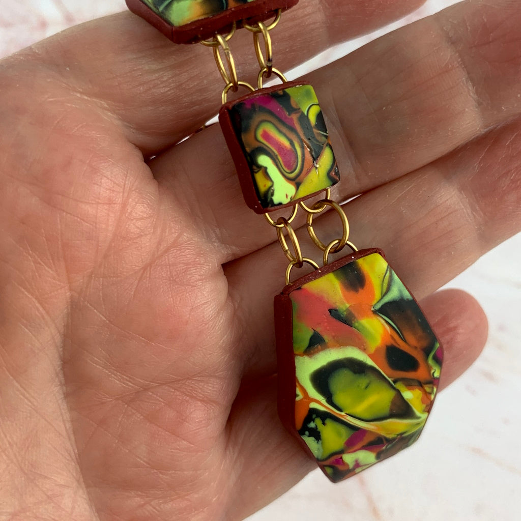 Close-up of handcrafted gold connector and oval jump rings in Summer Link Bracelet.