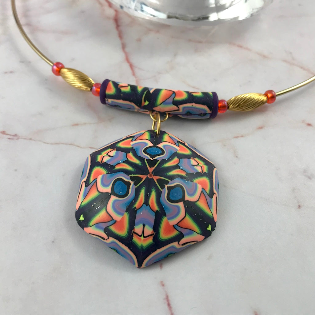 Contemporary handmade colourful necklace worn as a bold fashion statement piece.