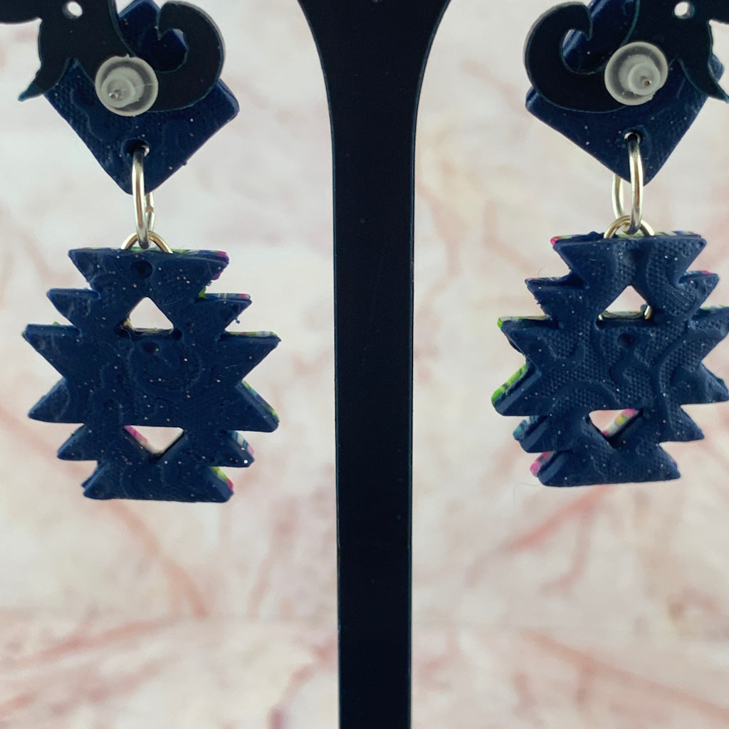 Back view of handmade Australian Aztec inspired drop earrings with navy textured finish and geometric cut-out design.