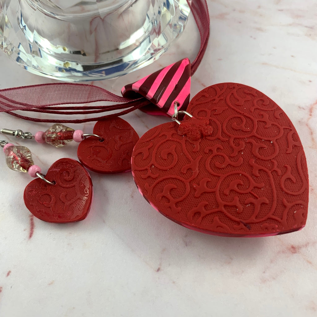 Handmade red and pink striped heart pendant necklace with matching earrings, bold statement jewellery set by Rennique Australia.