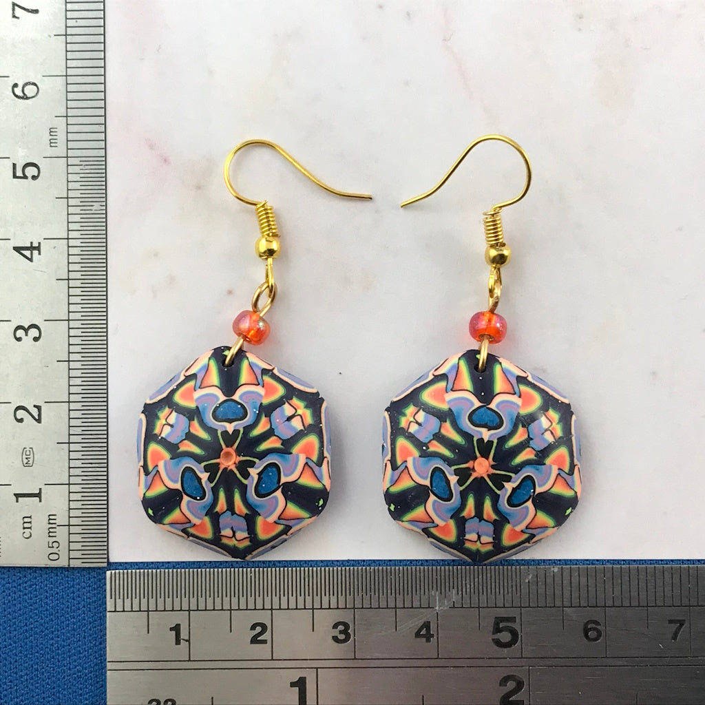 Handmade colourful earrings shown with ruler for accurate size reference and scale.