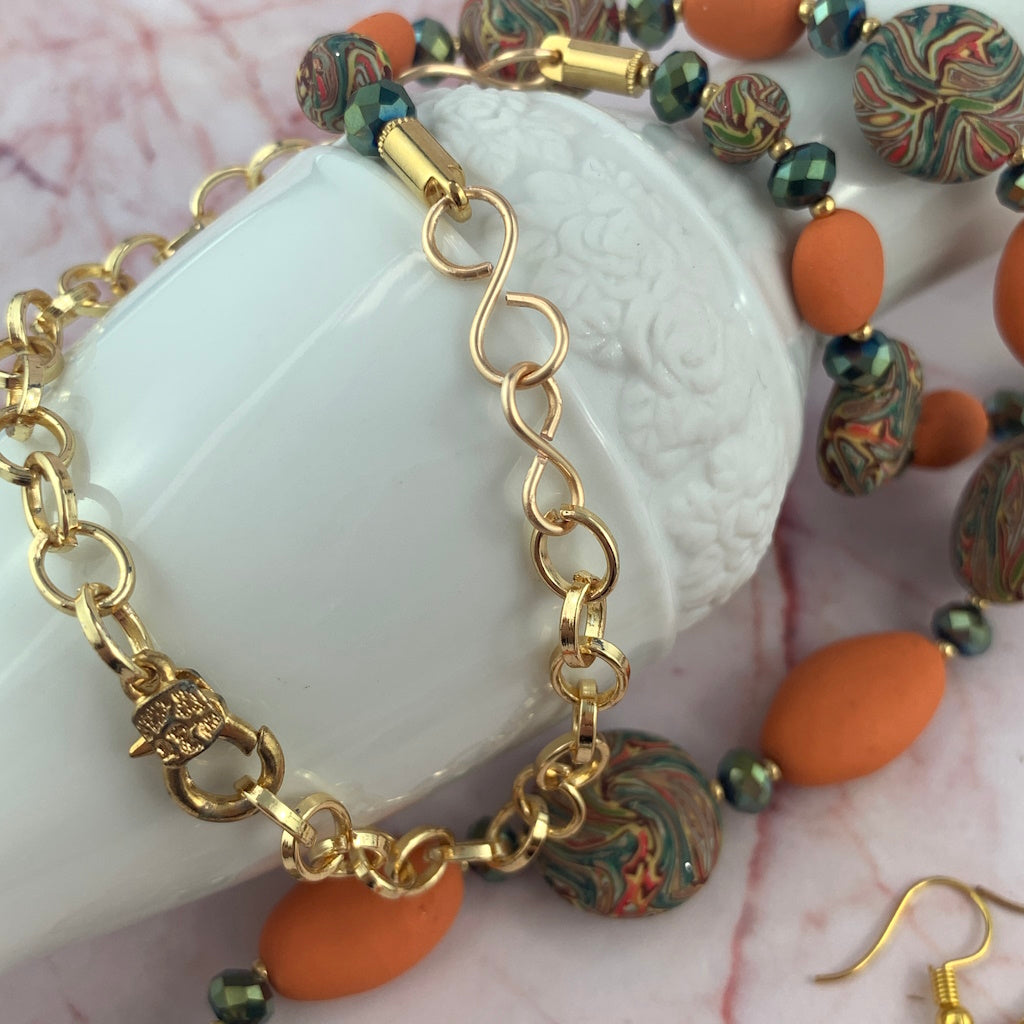 Close up of gold chain and lobster clasp on handmade statement necklace