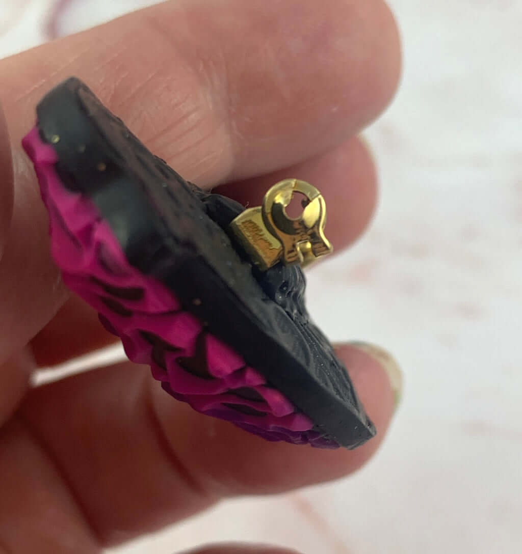 Close-up of bird brooch pin mechanism showing durable clasp and handcrafted finish by Rennique Australia