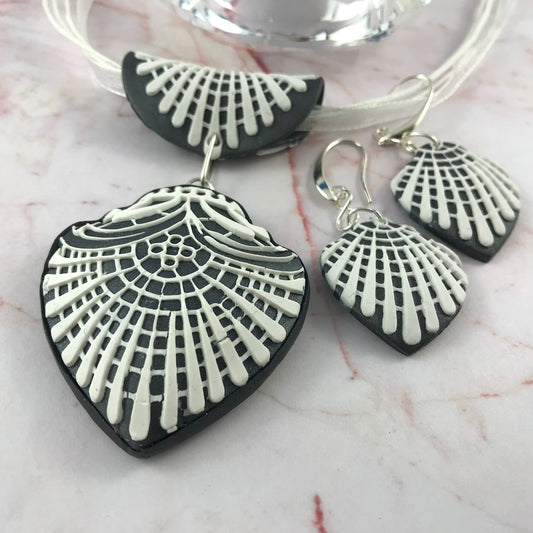 Handmade navy blue and white textured statement jewellery set featuring curved pendant necklace and matching earrings by Rennique Australia.