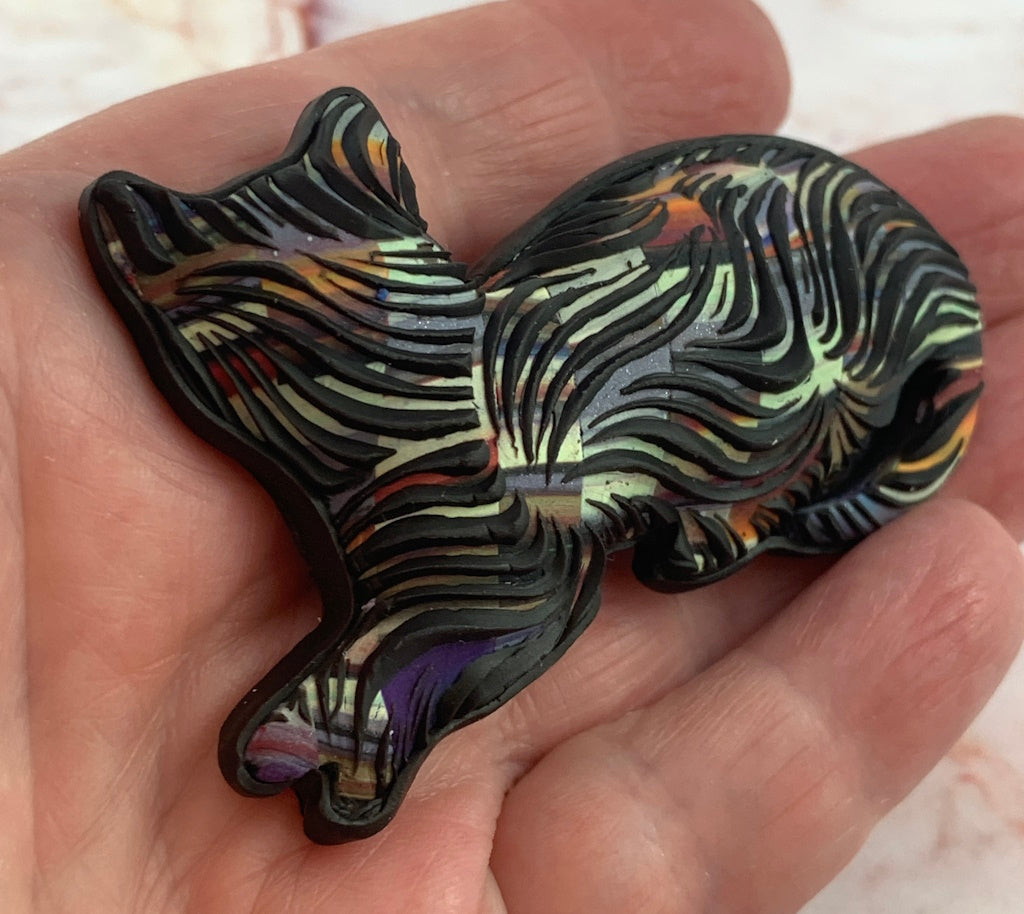 Front view of handmade kitty cat brooch with size reference, textured fur effect and rounded form