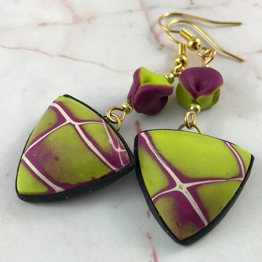 Handmade mustard and purple flash polymer clay statement earrings with matching top beads, lightweight domed design and gold hooks.