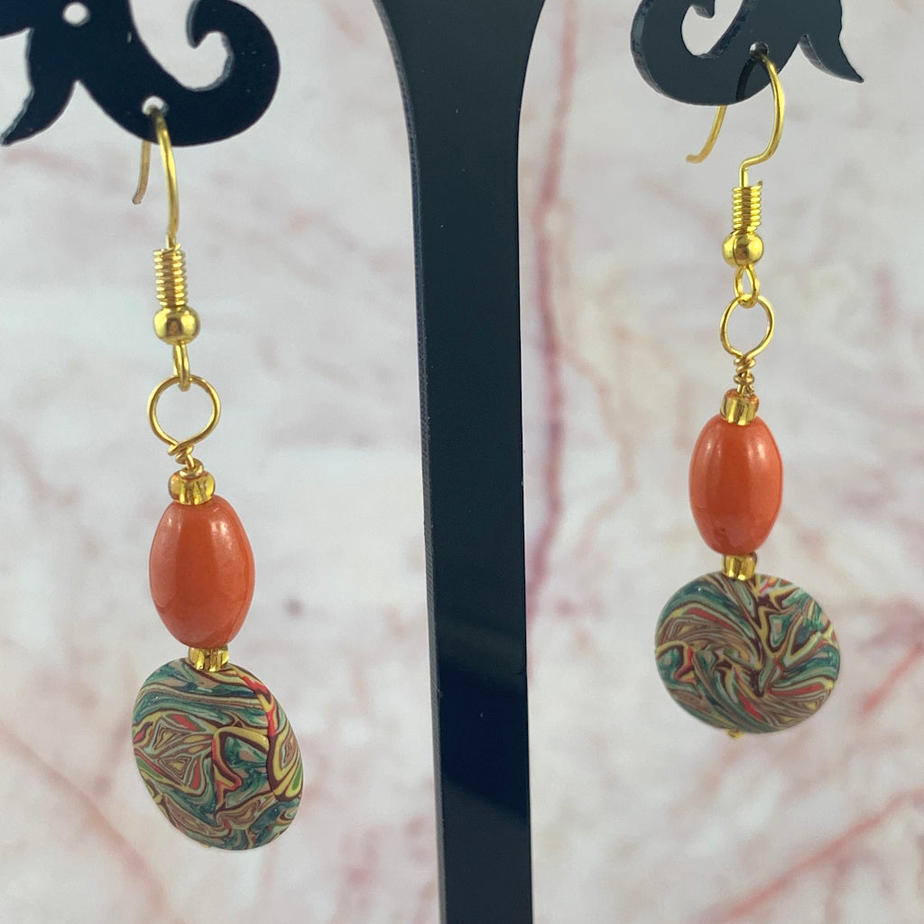 Handmade orange marble bead drop earrings with gold hooks, unique patterned round beads, artisan jewellery Australia