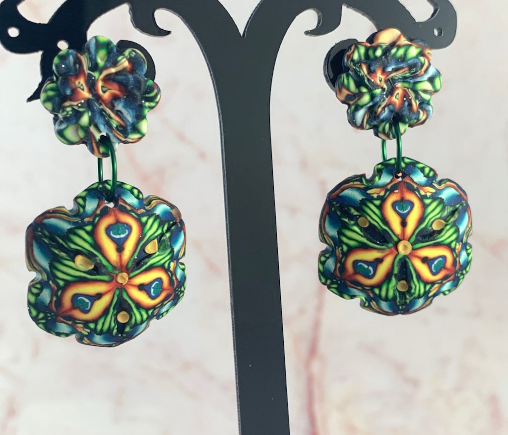 Australian artist made floral statement earrings by Rennique in blue, green and gold polymer clay design.