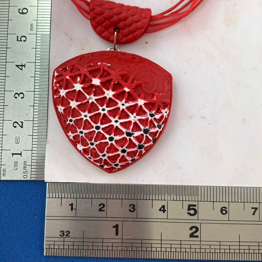 Rennique Australian artist made polymer clay statement pendant necklace in red geometric lace design with size reference