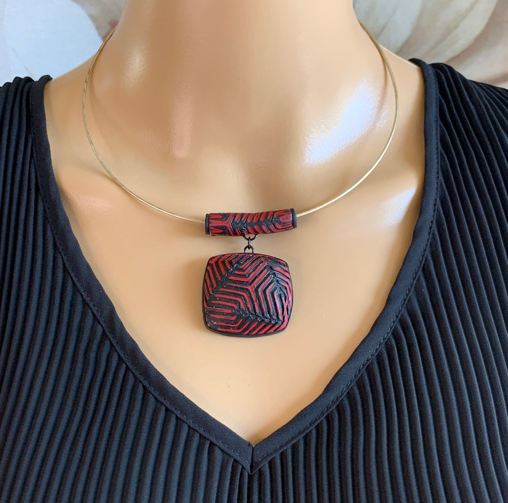 Rennique Australian artist made polymer clay statement necklace in red and black geometric textured pendant