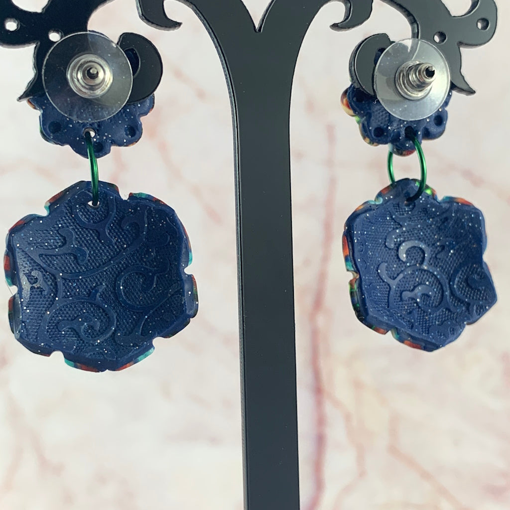 Back view of Australian handmade statement earrings by Rennique with embossed textured navy reverse and artisan finish.