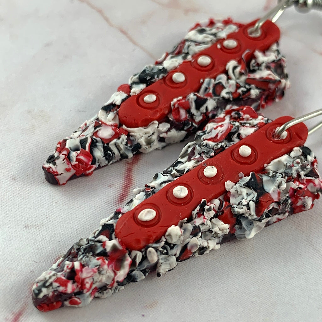 Rennique geometric polymer clay earrings with high-contrast black, white and crimson textured surface detail