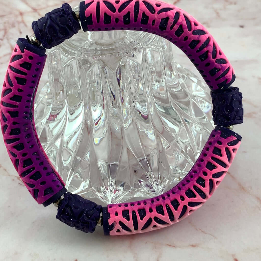Rennique pink purple bracelet top view geometric pattern polymer clay bangle bold modern handmade jewellery symmetrical design