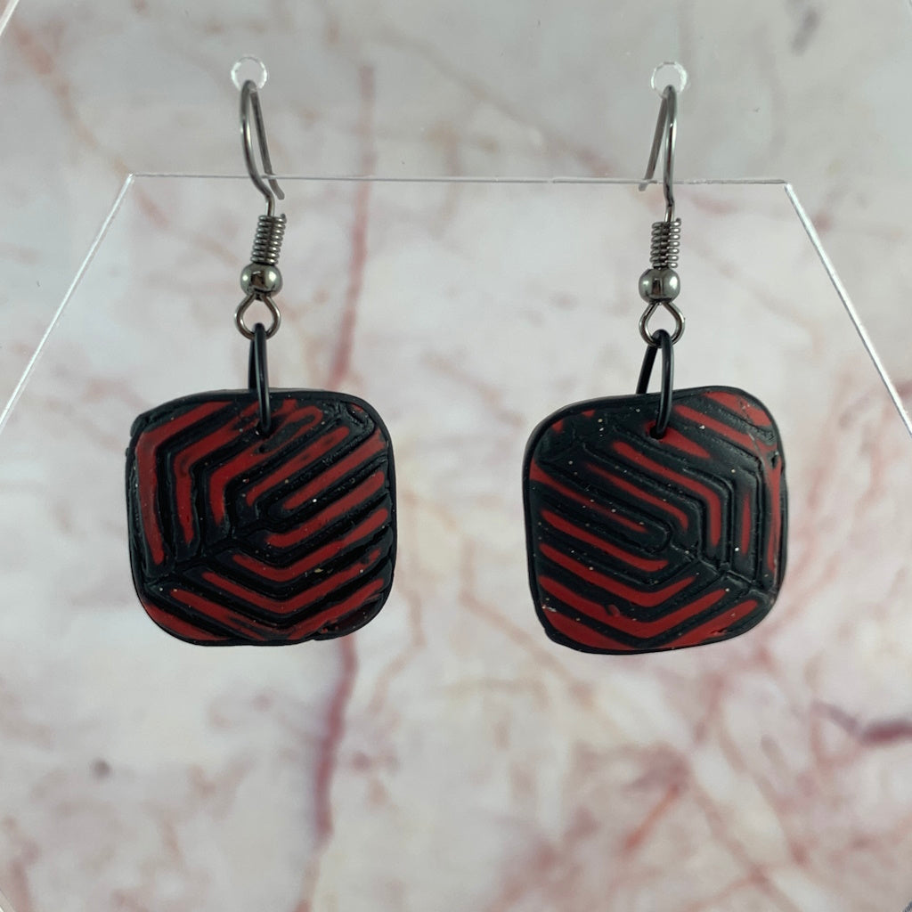 Rennique Australian artist made polymer clay drop earrings in red and black geometric textured design