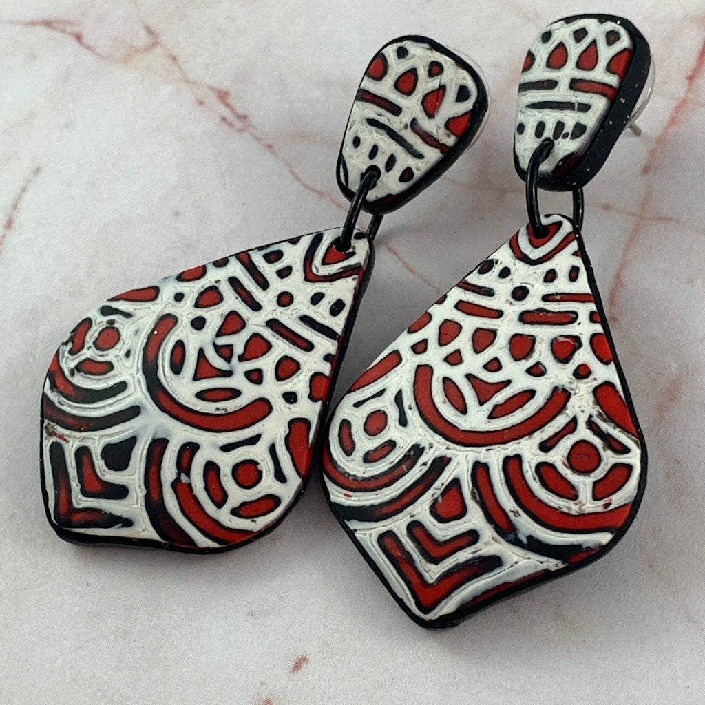Rennique red black white mandala earrings close up view handmade polymer clay statement earrings bold geometric pattern lightweight wearable art artisan jewellery
