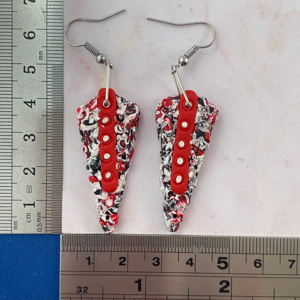 Rennique statement polymer clay earrings in red, black and white shown with ruler for size reference