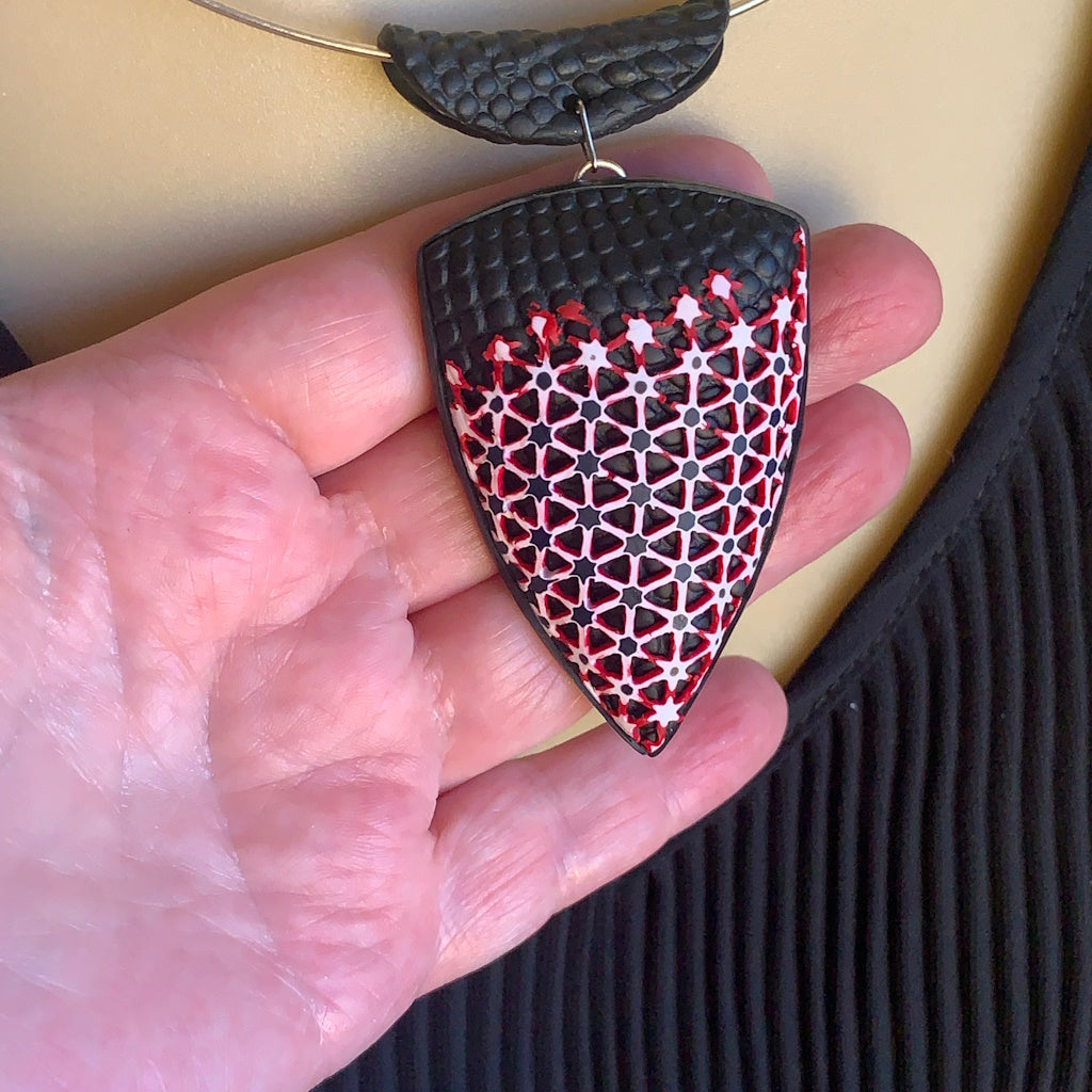 Rennique statement pendant size scale in hand black red polymer clay jewellery bold geometric design wearable art lightweight handcrafted