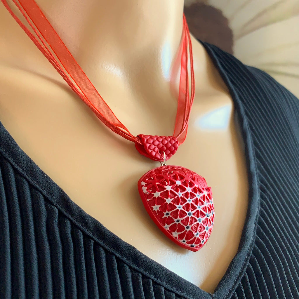 Rennique Australian artist made wearable art polymer clay necklace with bold crimson geometric lace pendant on mannequin