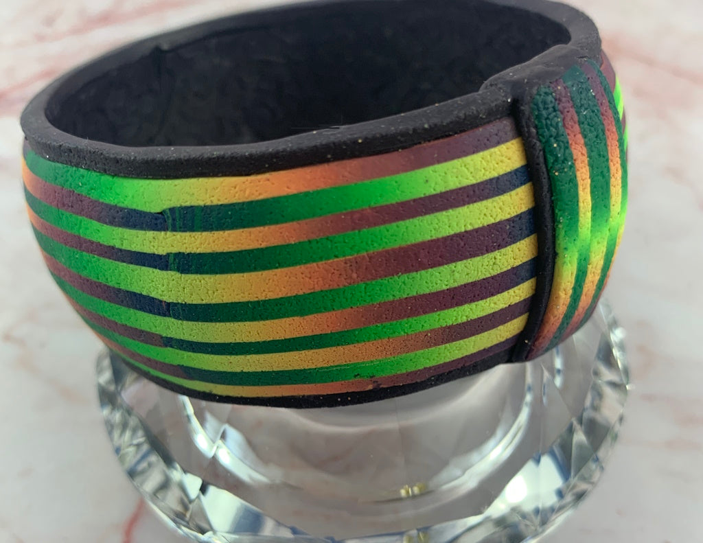 Luxury artisan bracelet by Rennique featuring bold striped multicolour design for women.