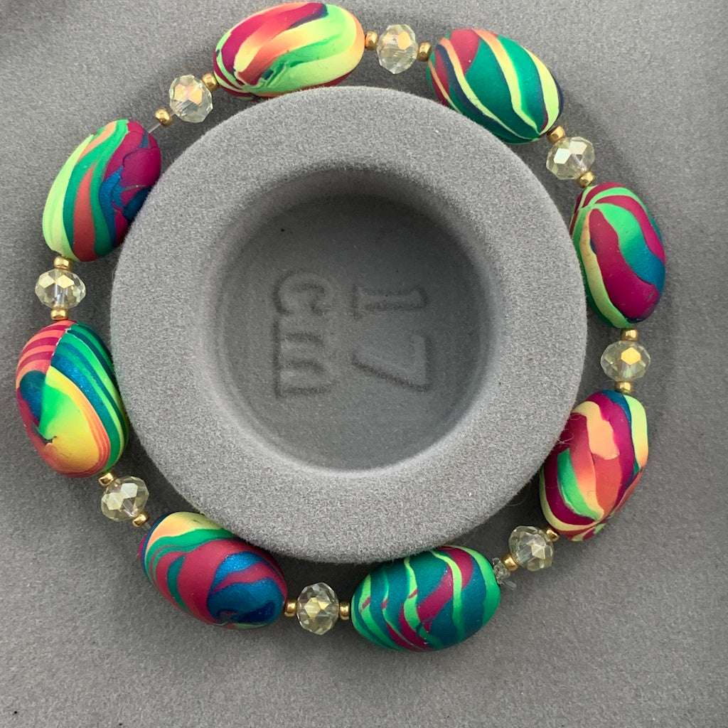 Rennique handcrafted 17 cm colourful beaded bracelet featuring bold striped artisan beads in teal, pink, lime and coral with crystal accents and gold spacer details, handmade Australian statement jewellery.