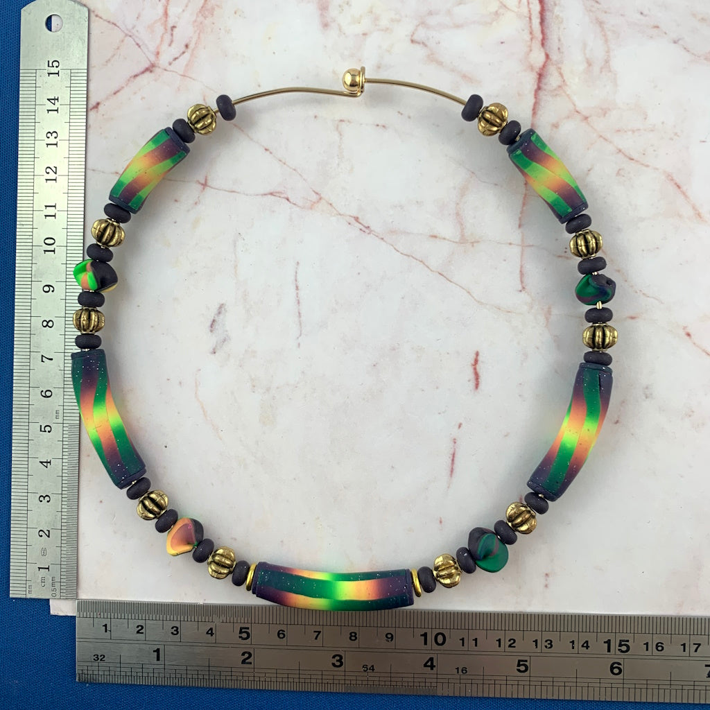 Handmade Rennique short statement necklace for ladies shown with measurements featuring green gold and purple artisan beads and premium designer finish.