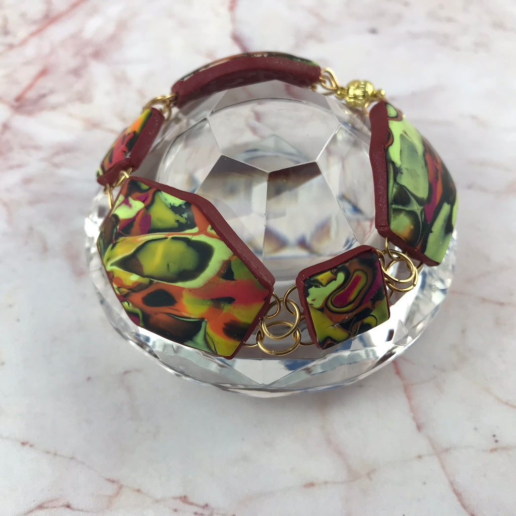 Handmade Summer Link Bracelet displayed in crystal styling setup, highlighting sculptural artisan links.