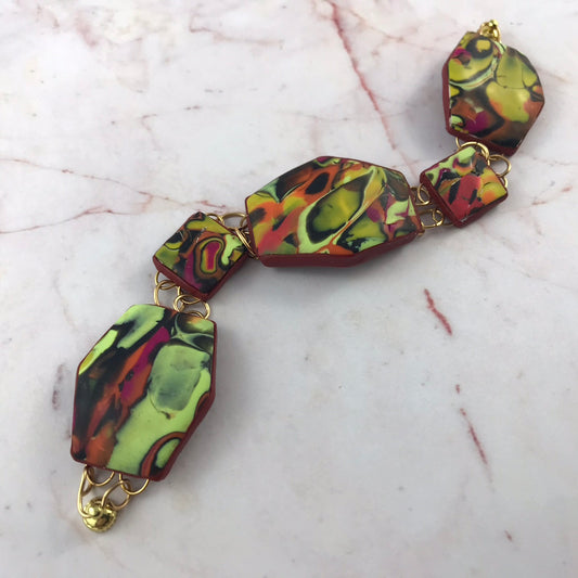 Handmade Summer Link Bracelet front view featuring curved textured polymer clay links and magnetic clasp by Rennique.