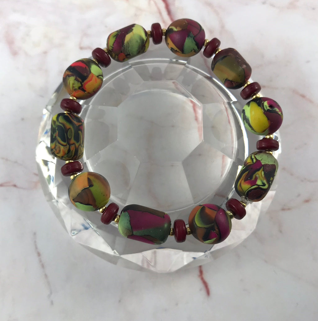 Handmade contemporary bracelet displayed in glass styling setup, highlighting unique artisan beadwork.