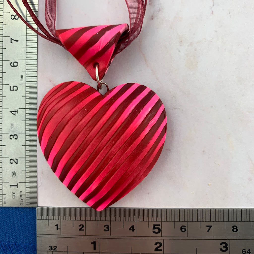 Handmade Valentine-inspired pink and red heart pendant necklace  by Rennique.