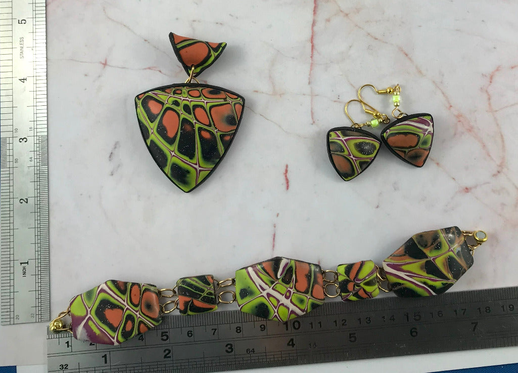 Artisan polymer clay jewellery set including statement pendant necklace, matching earrings and bracelet with bold abstract pattern, handcrafted unique design Australia