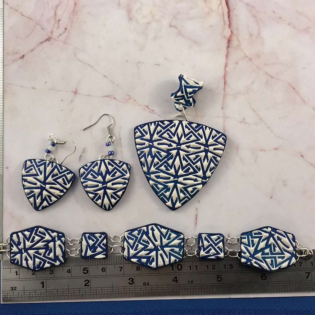 Full blue and white polymer clay jewellery set displayed with ruler showing necklace, earrings, and bracelet dimensions.