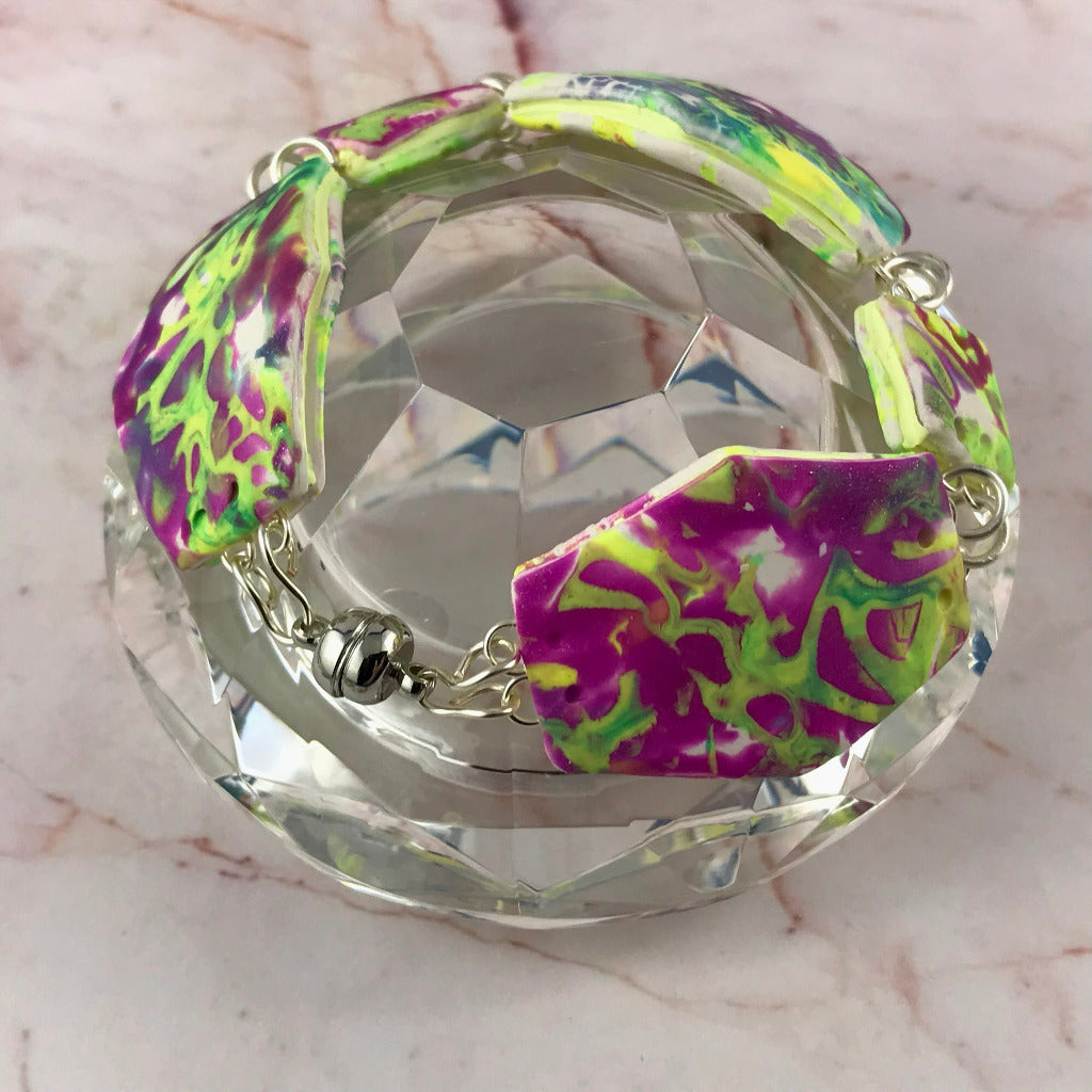 Close-up of bold abstract bracelet with handcrafted metal wire detailing