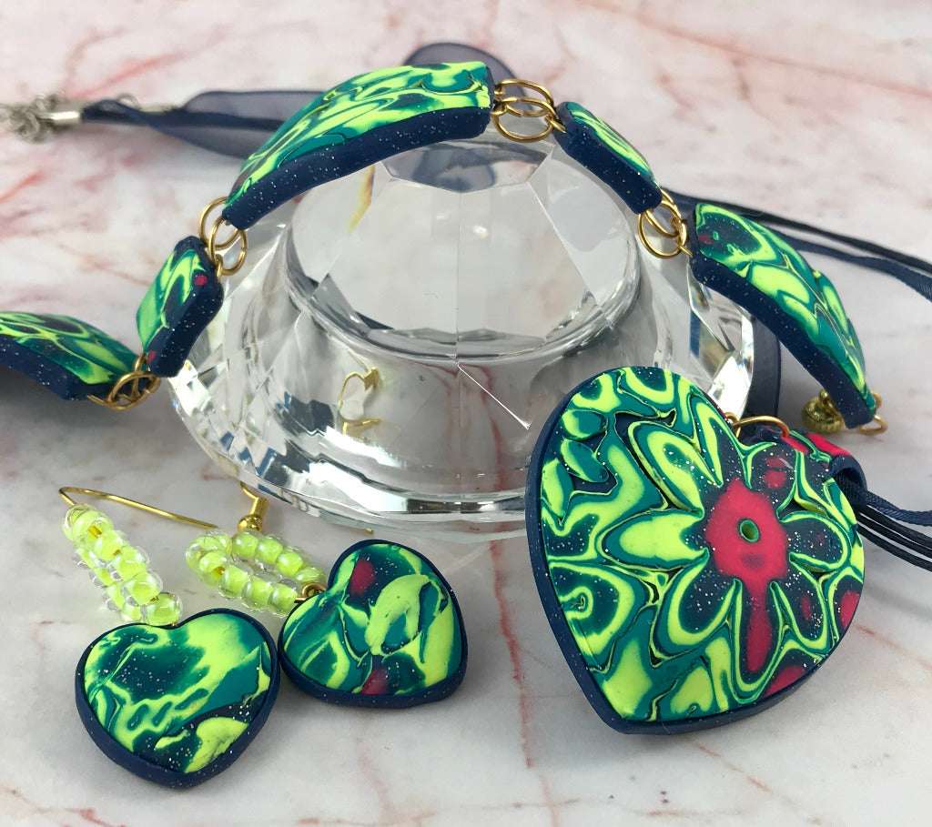 Handmade heart pendant necklace with matching earrings and bracelet in neon green floral polymer clay, Australian statement jewellery set