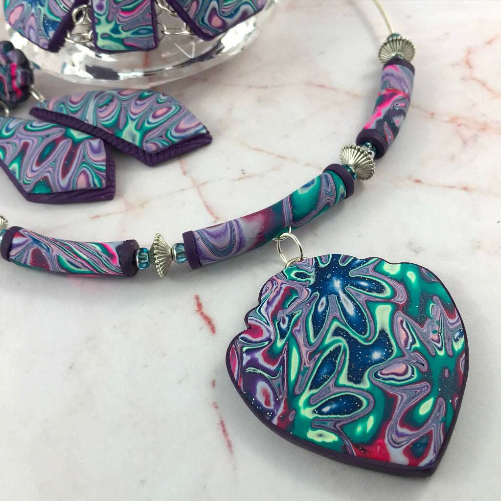 Detailed back view of Cosmic Flower heart pendant in handcrafted polymer clay with textured purple finish, one of a kind statement necklace Australia