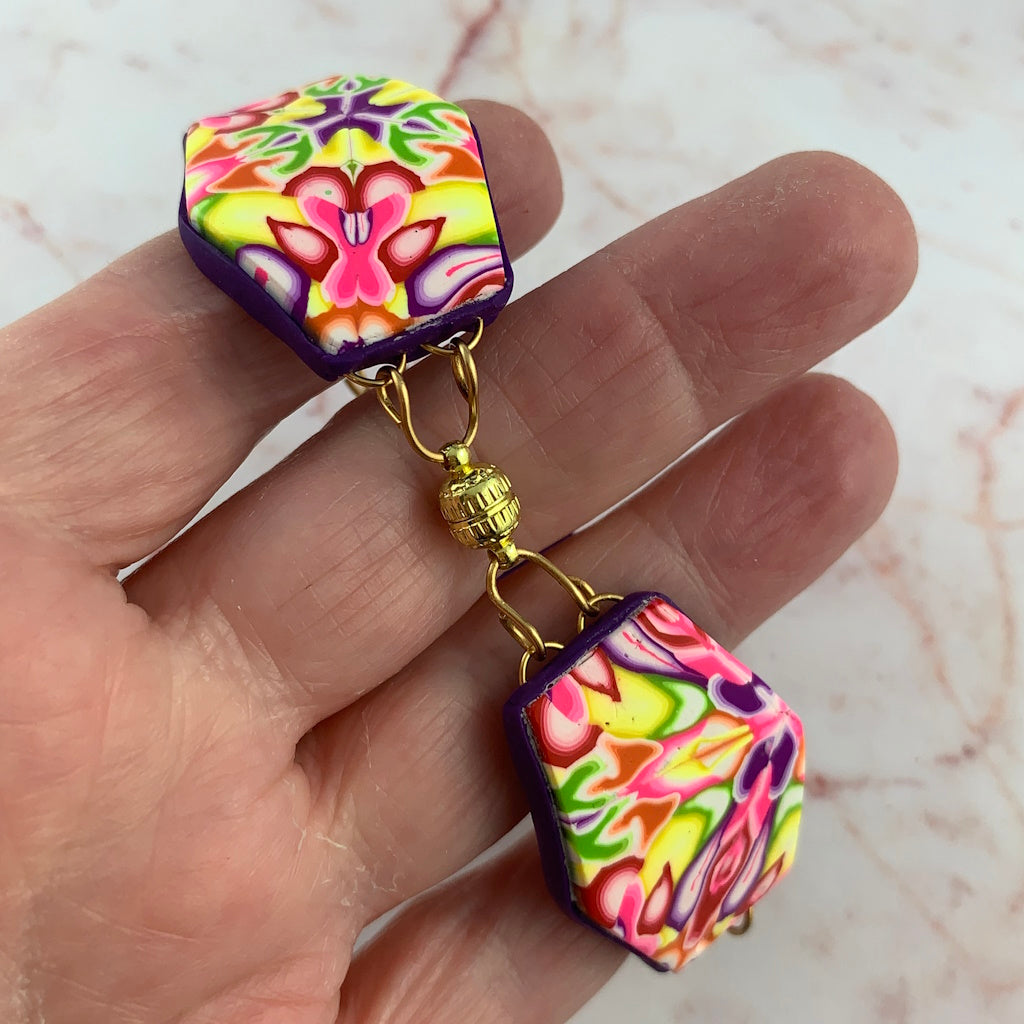 Close-up of handmade floral polymer clay bracelet with gold connector detail by Rennique Australia.