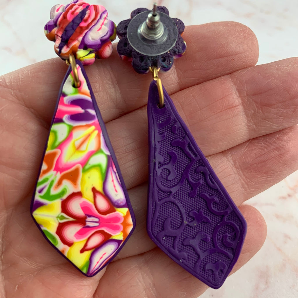 Front and back view of handmade floral polymer clay drop earrings showing vibrant front pattern and artisan back finish by Rennique Australia.