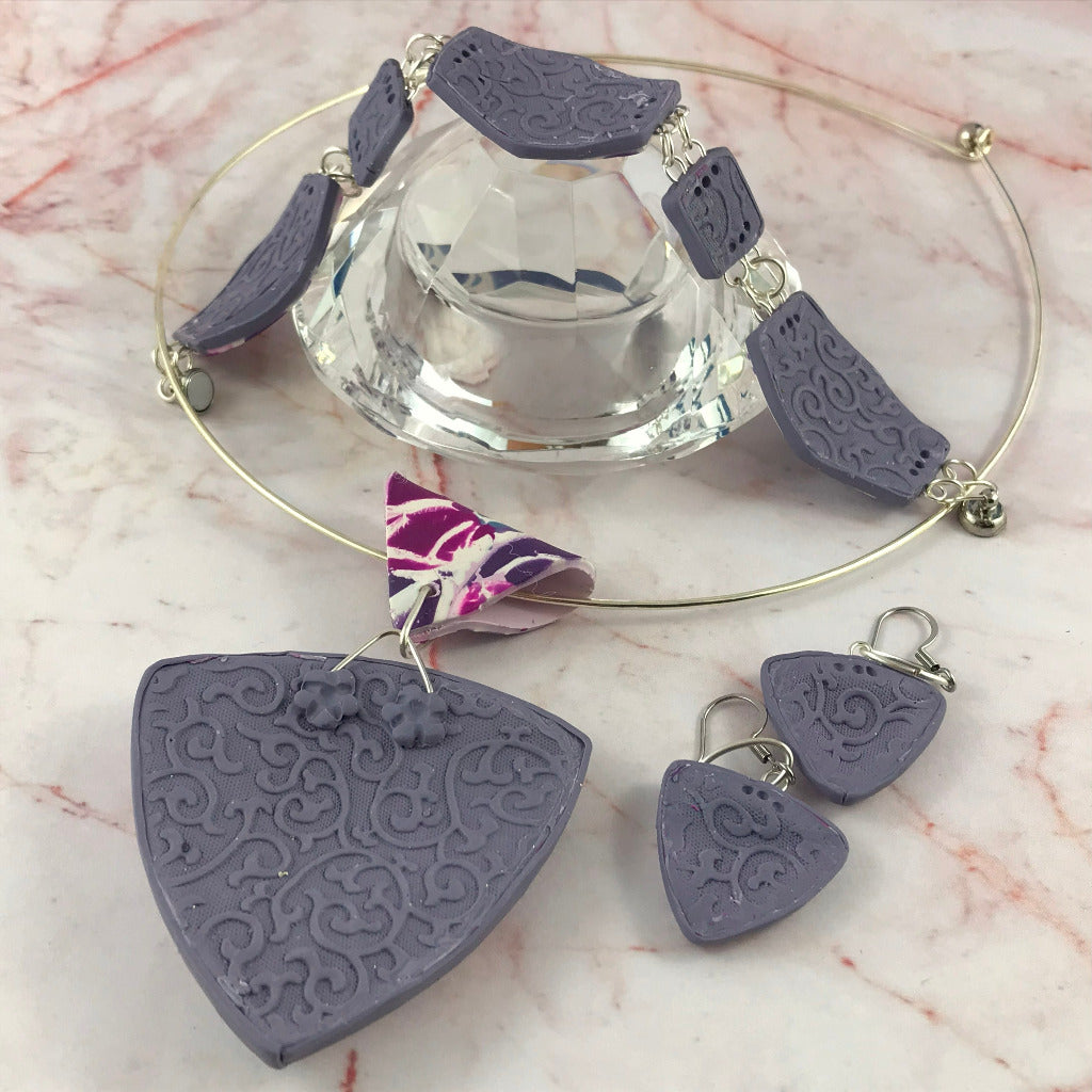 Back view of handmade lavender polymer clay jewellery set showing textured artisan finish on pendant, earrings and bracelet, made in Australia