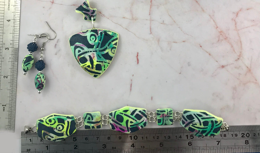 Complete handmade Melbourne laneway jewellery set with pendant, earrings and bracelet displayed with ruler for sizing, artisan polymer clay jewellery Australia