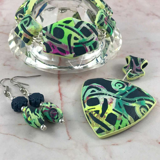 Handmade Melbourne laneway inspired polymer clay jewellery set featuring statement pendant necklace, bracelet and matching earrings in green, black and abstract graffiti pattern, artisan jewellery Australia