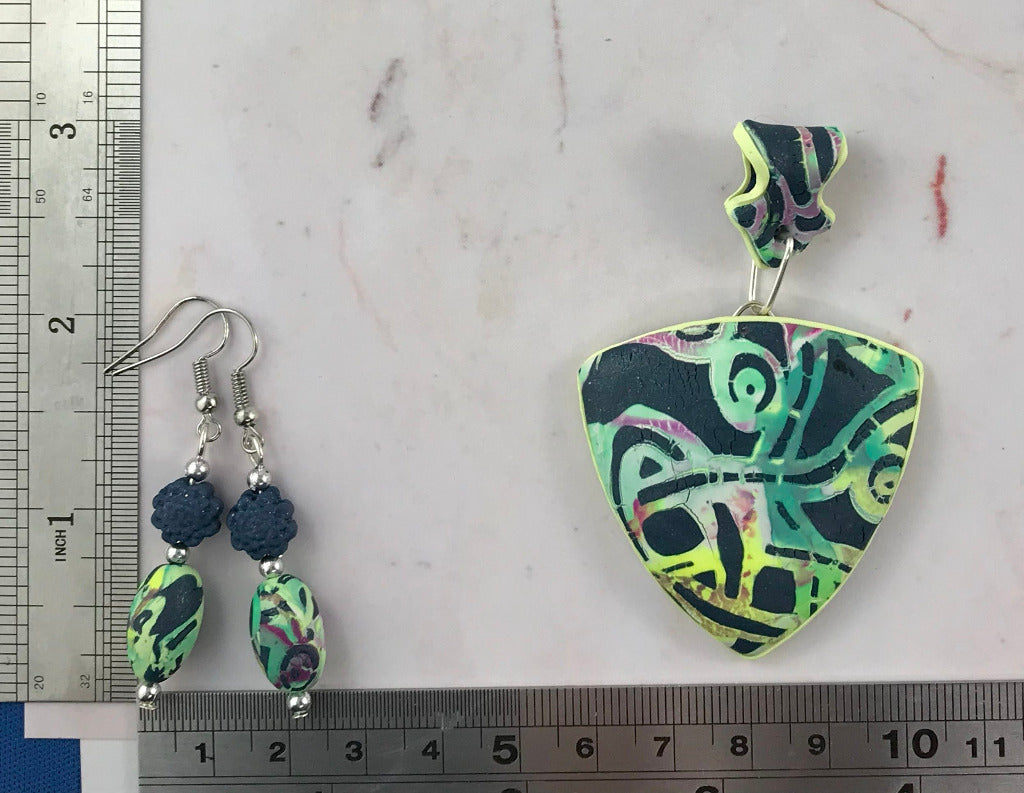 Handmade Melbourne laneway pendant and matching earrings shown with ruler for size reference, green abstract artisan jewellery set Australia