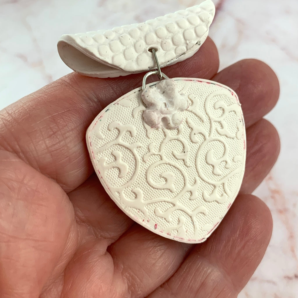 Modern red abstract pendant necklace handmade statement jewelry side view on model