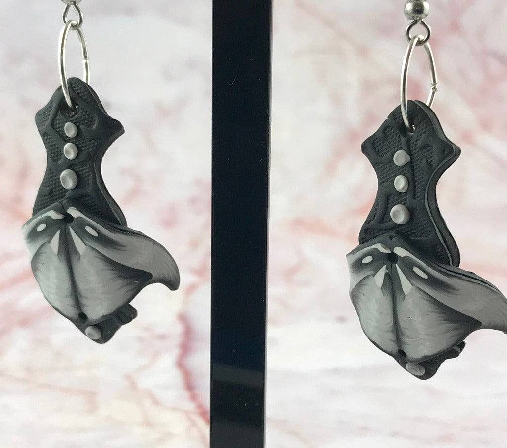 Handmade monochrome statement earrings in black white and grey polymer clay with curved artistic design and silver shepherd hooks, artisan jewellery Australia
