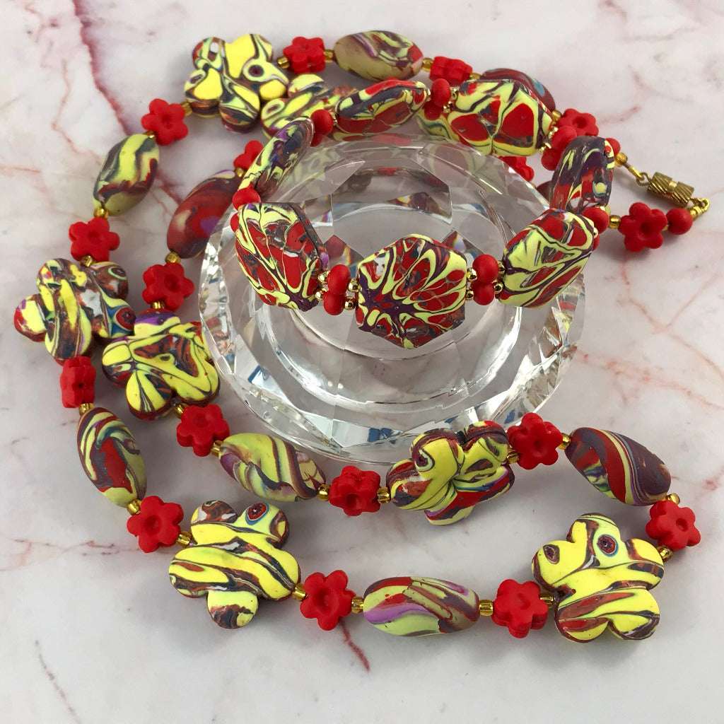 Complete handmade red and yellow jewellery set with necklace, bracelet and matching earrings